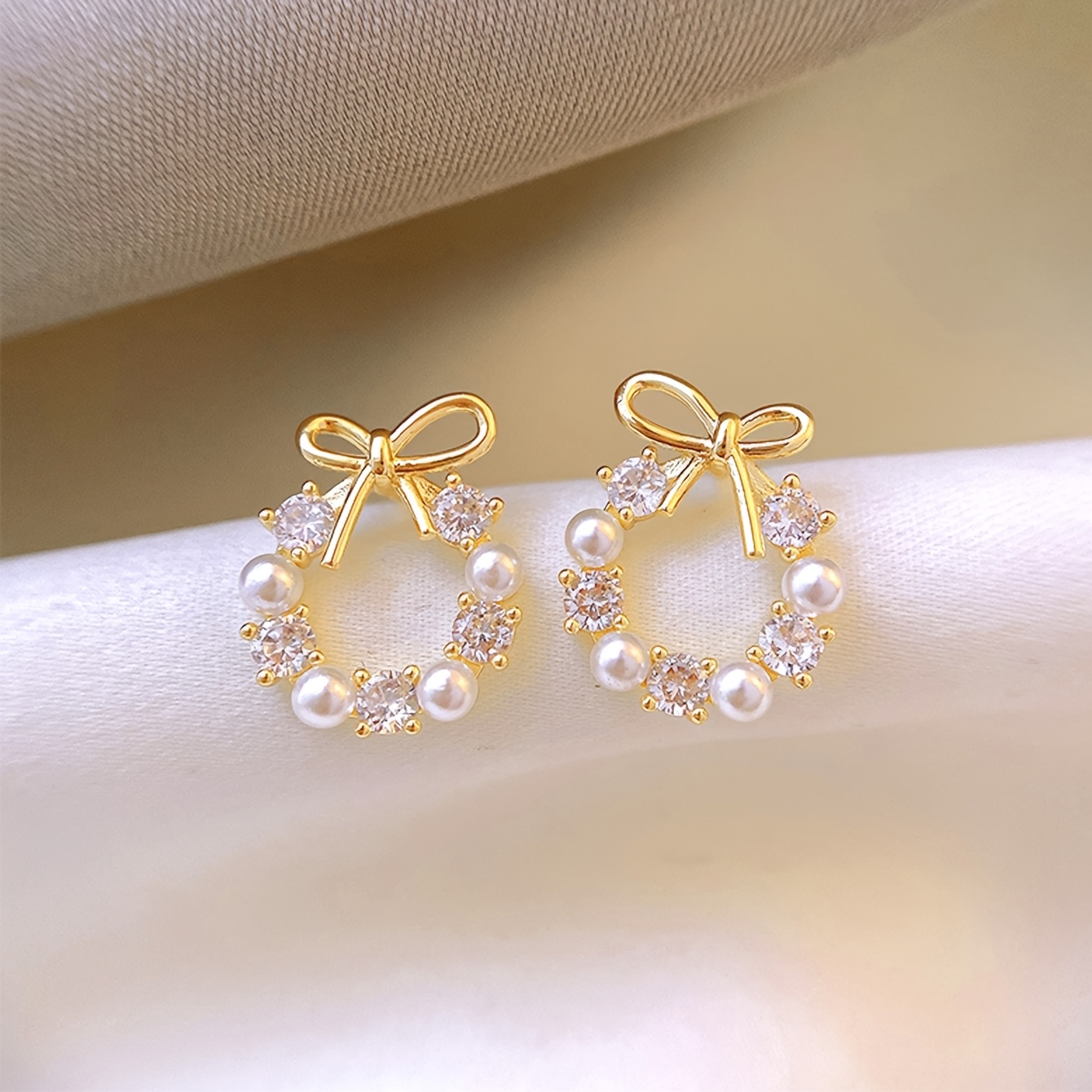 A Pair of Stylish And Luxurious Hollow Bow Earrings in a Simple Circular Design, Perfect for The Wedding Season. - Image 3